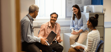 Group of doctors sitting together having a discussion
